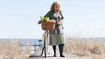 A woman on a bar wearing compression stockings.